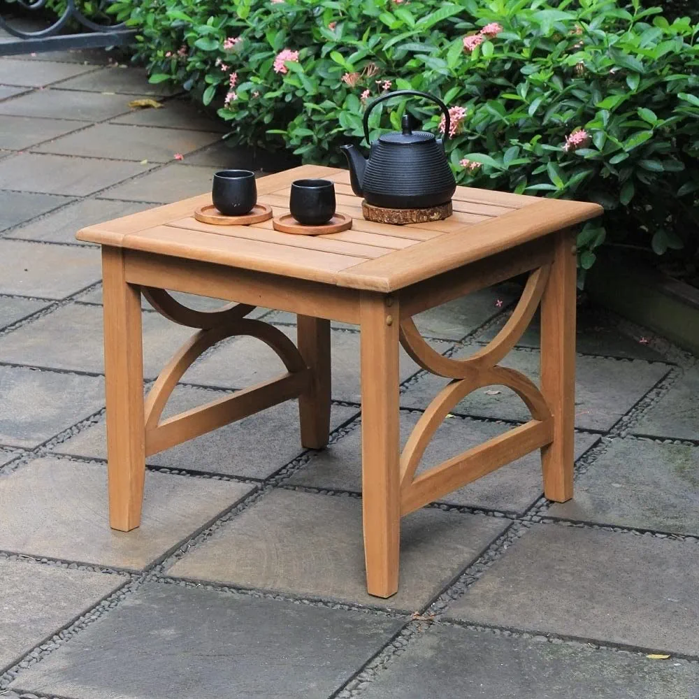 Square teak outdoor side table with natural finish, crafted from premium Indonesian teak wood, featuring openwork arched side details and a sturdy, weather-resistant build ideal for patios and garden spaces.
