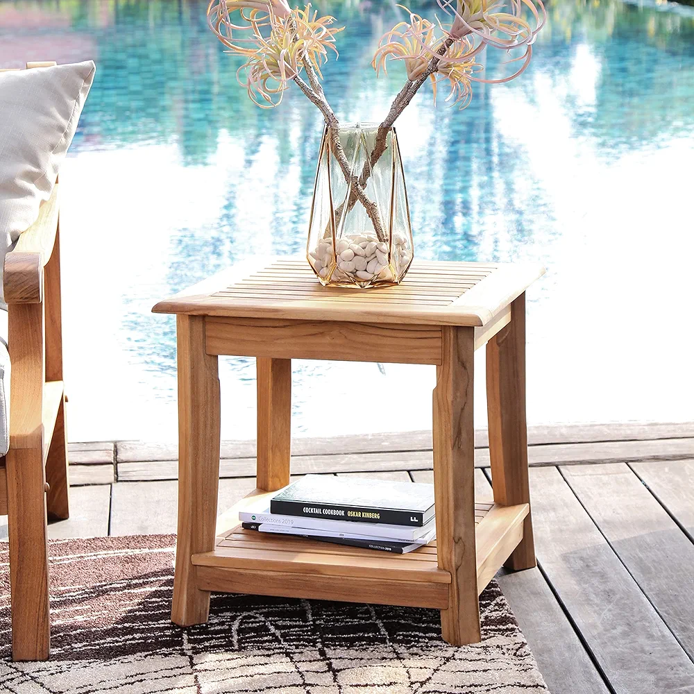 Square teak outdoor side table with a lantern-inspired design and built-in lower shelf, crafted from natural unfinished Indonesian teak wood; durable, weather-resistant, and ideal for stylish patio or garden use.